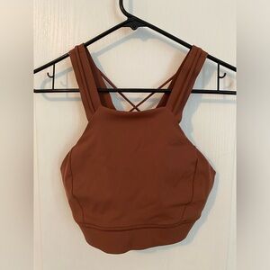 Lululemon brown size 6 sports bra with lace up back detail.